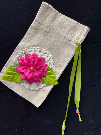 Drawstring bag with pink flower