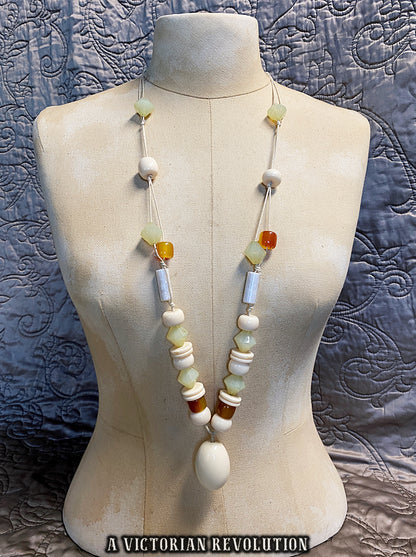 Vintage 1970s Art Deco Revival Knotted Bead Necklace with Cream Amber + Green Beads