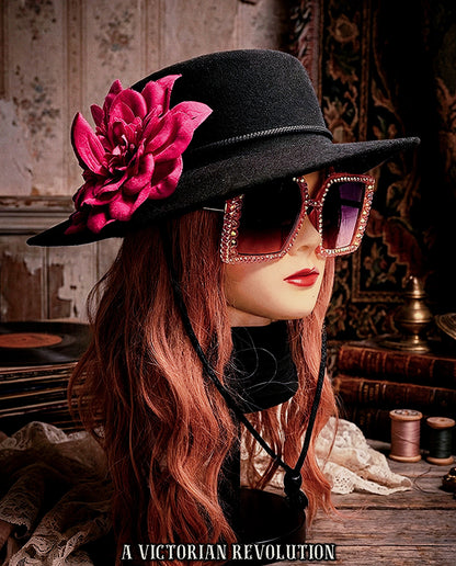 Black Wide Brimmed Hat with a Fuchsia Flower