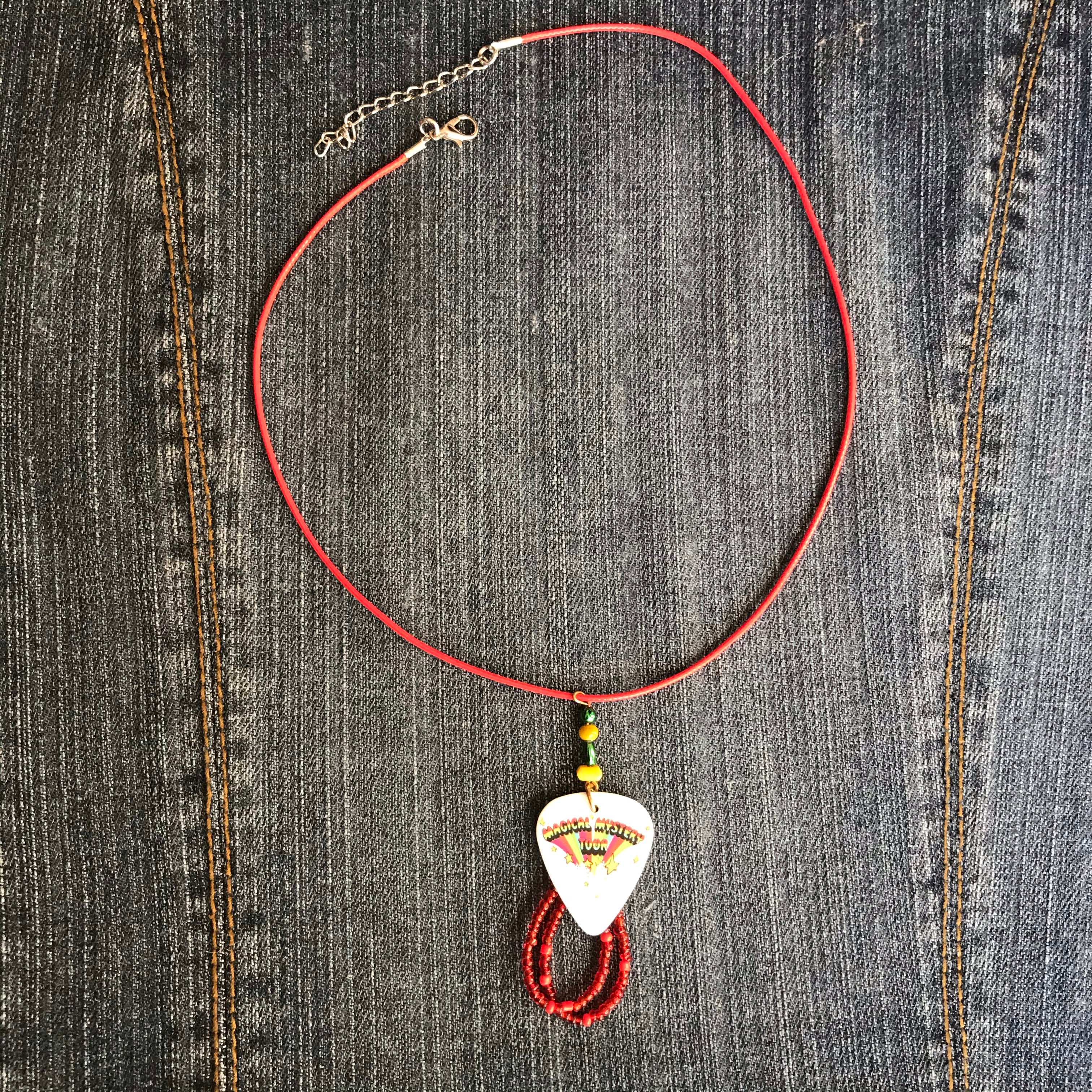 I want to turn a guitar pick into a necklace. How can I protect it from  scratching off? : r/Ghostbc